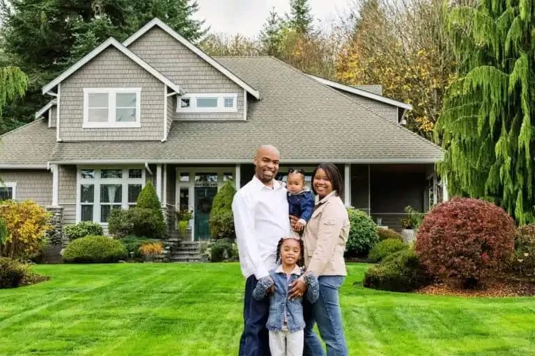 Happy Family in front of house