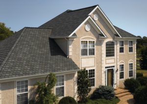 Large suburban home with grey asphalt shingle roofing 